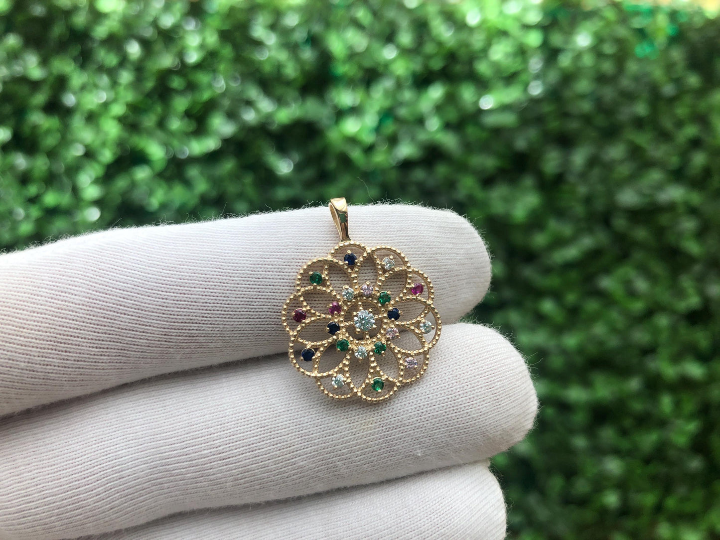14k gold pattern pendant with multicolor gemstones