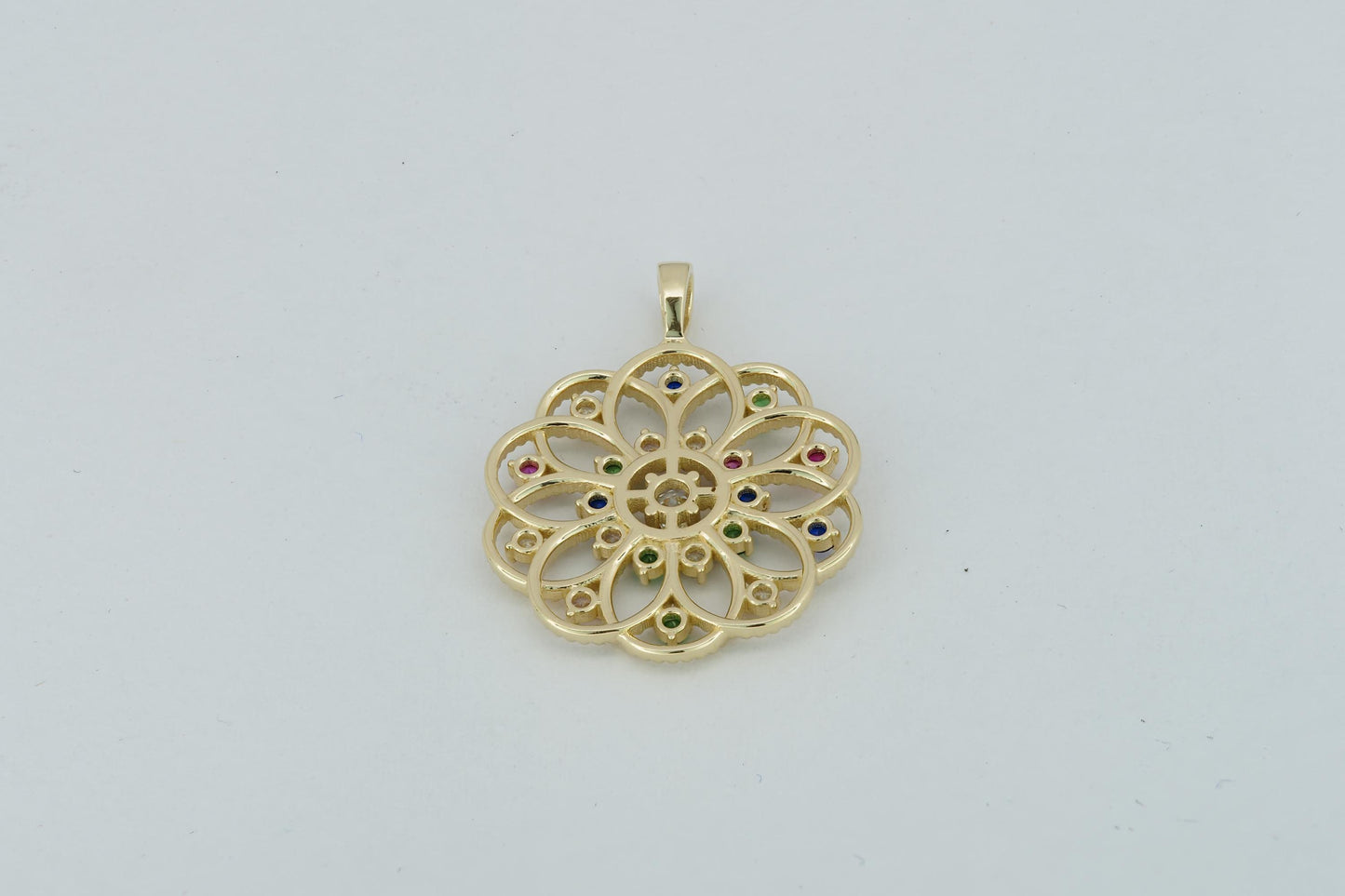 14k gold pattern pendant with multicolor gemstones