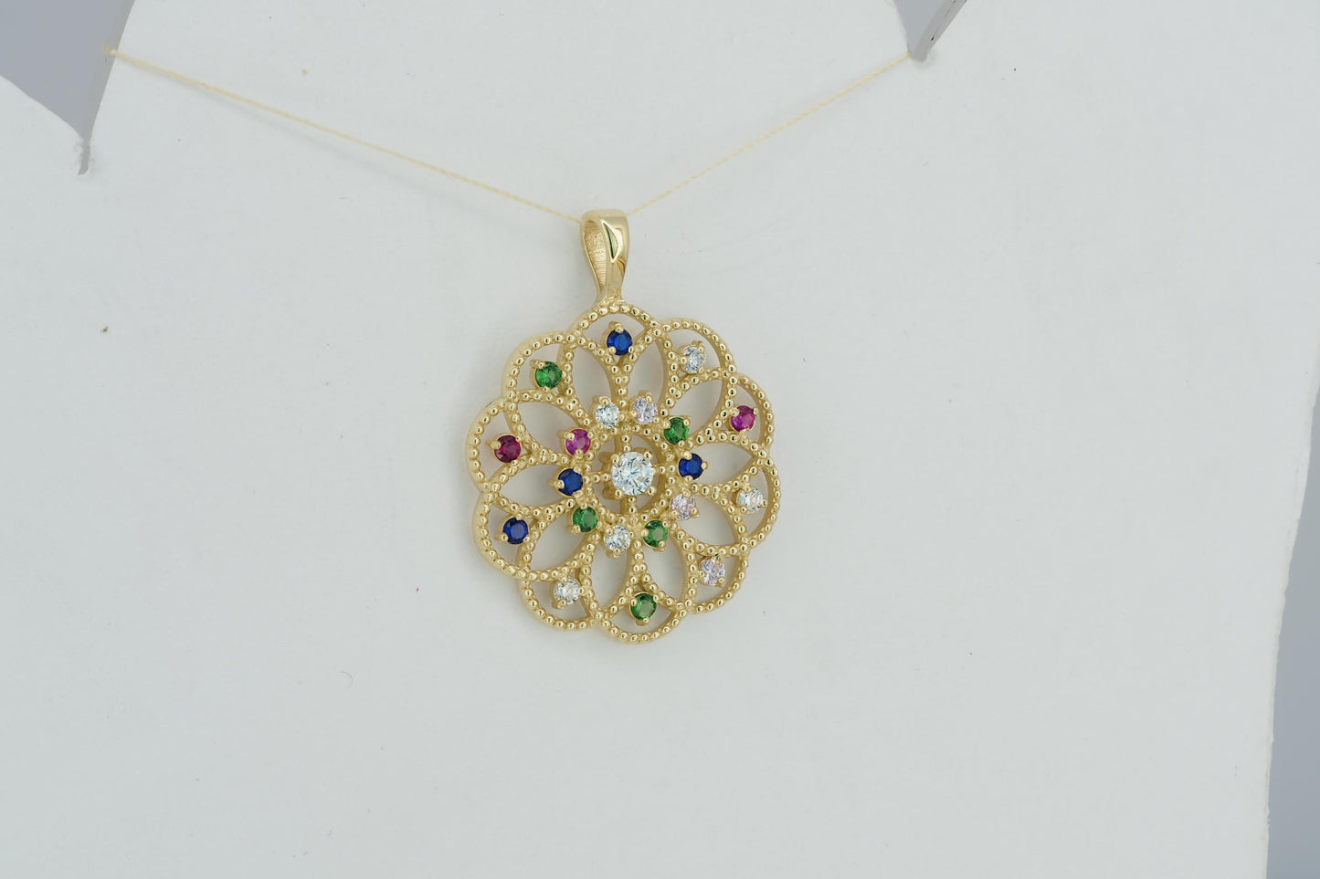 14k gold pattern pendant with multicolor gemstones