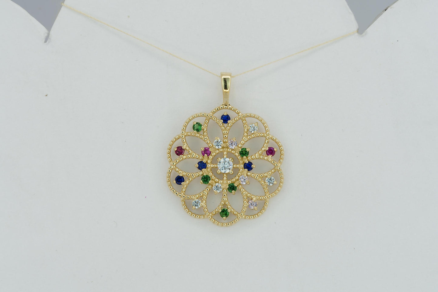 14k gold pattern pendant with multicolor gemstones