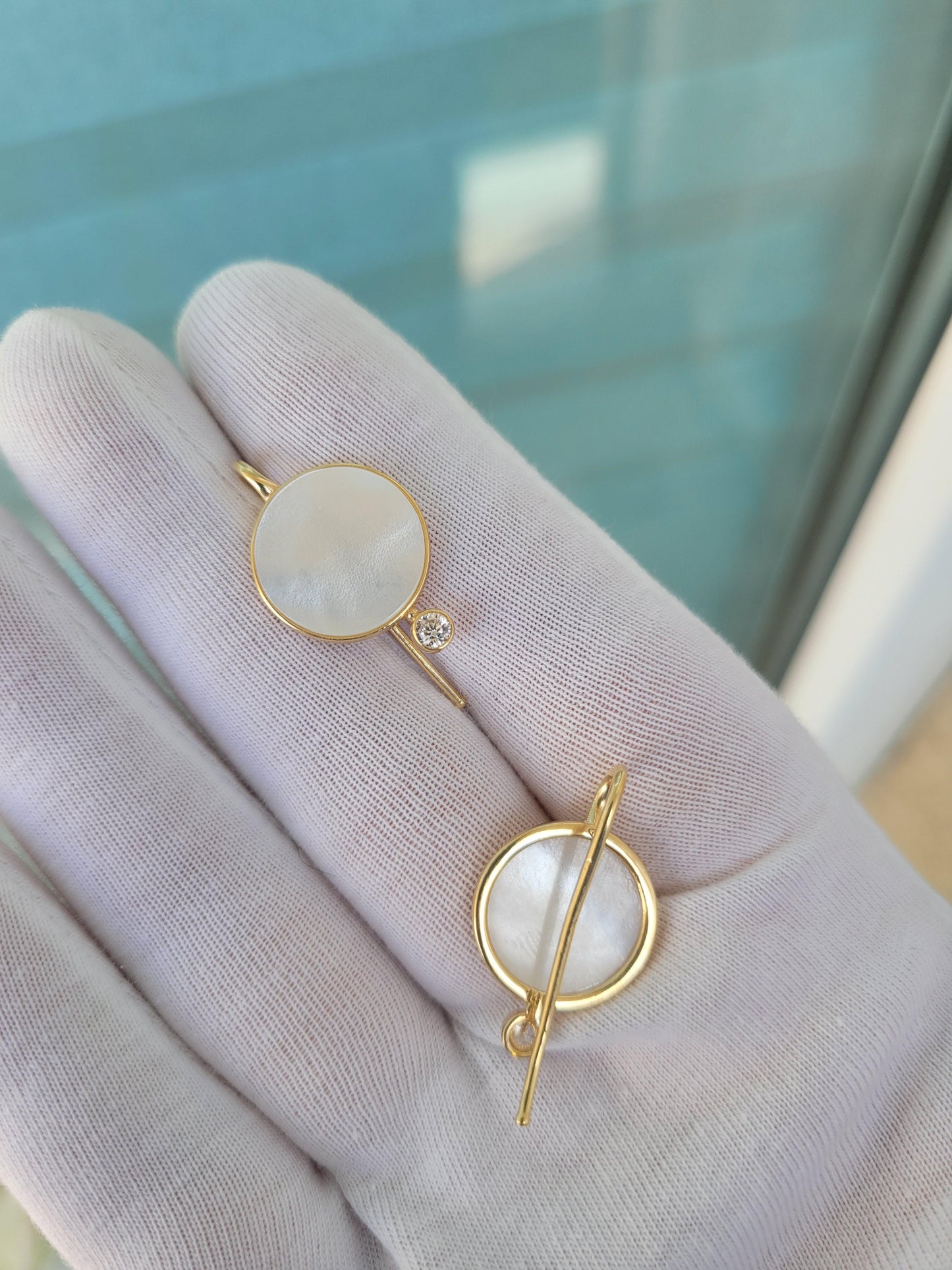 White Mother Of Pearl Shell Earrings with moissanite.