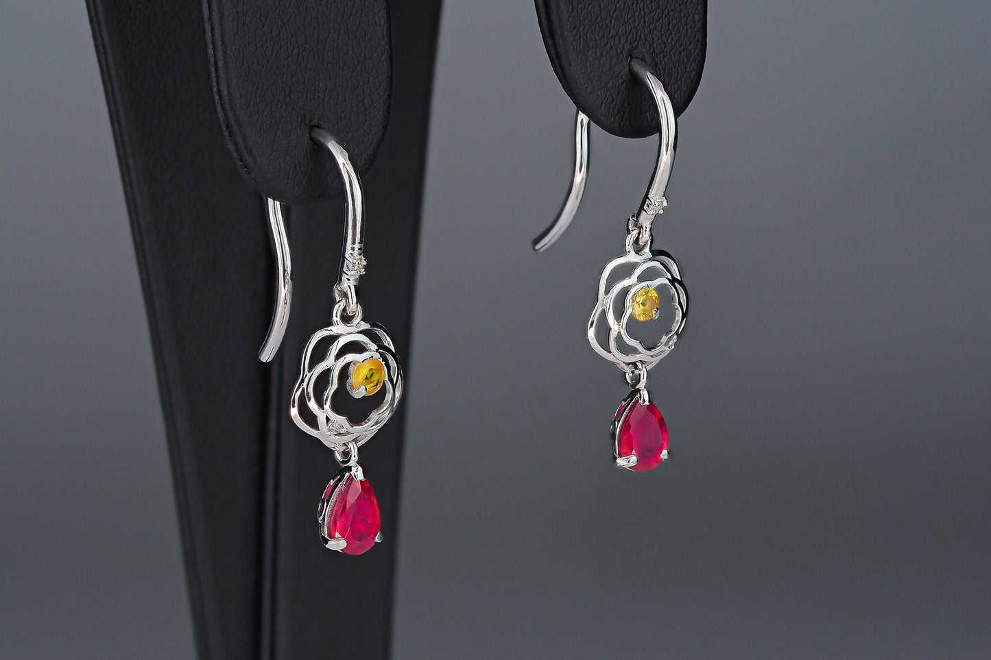 Pear ruby drop earrings in 14k gold
