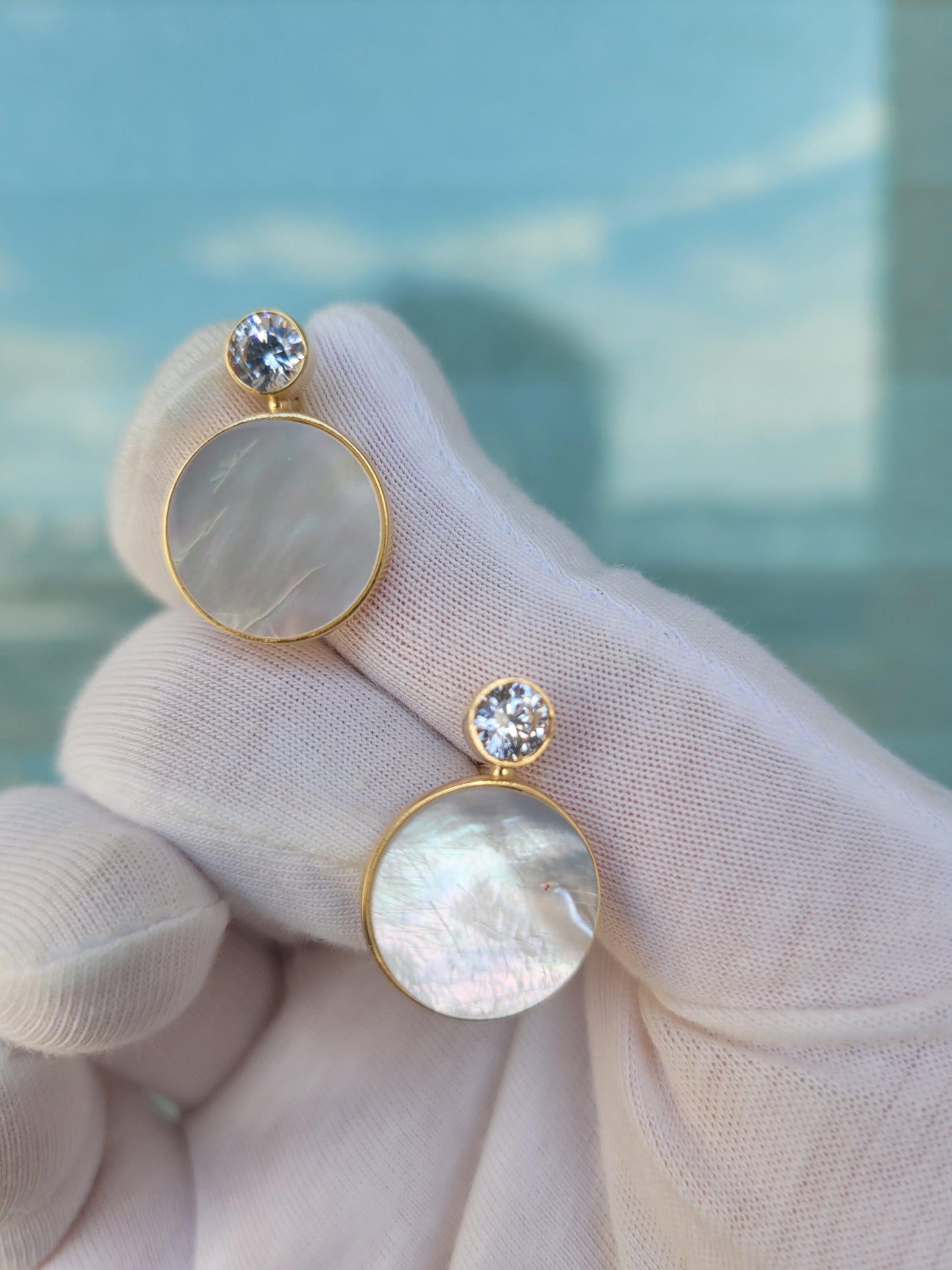 White Mother Of Pearl Shell Stud Earrings with moissanite.