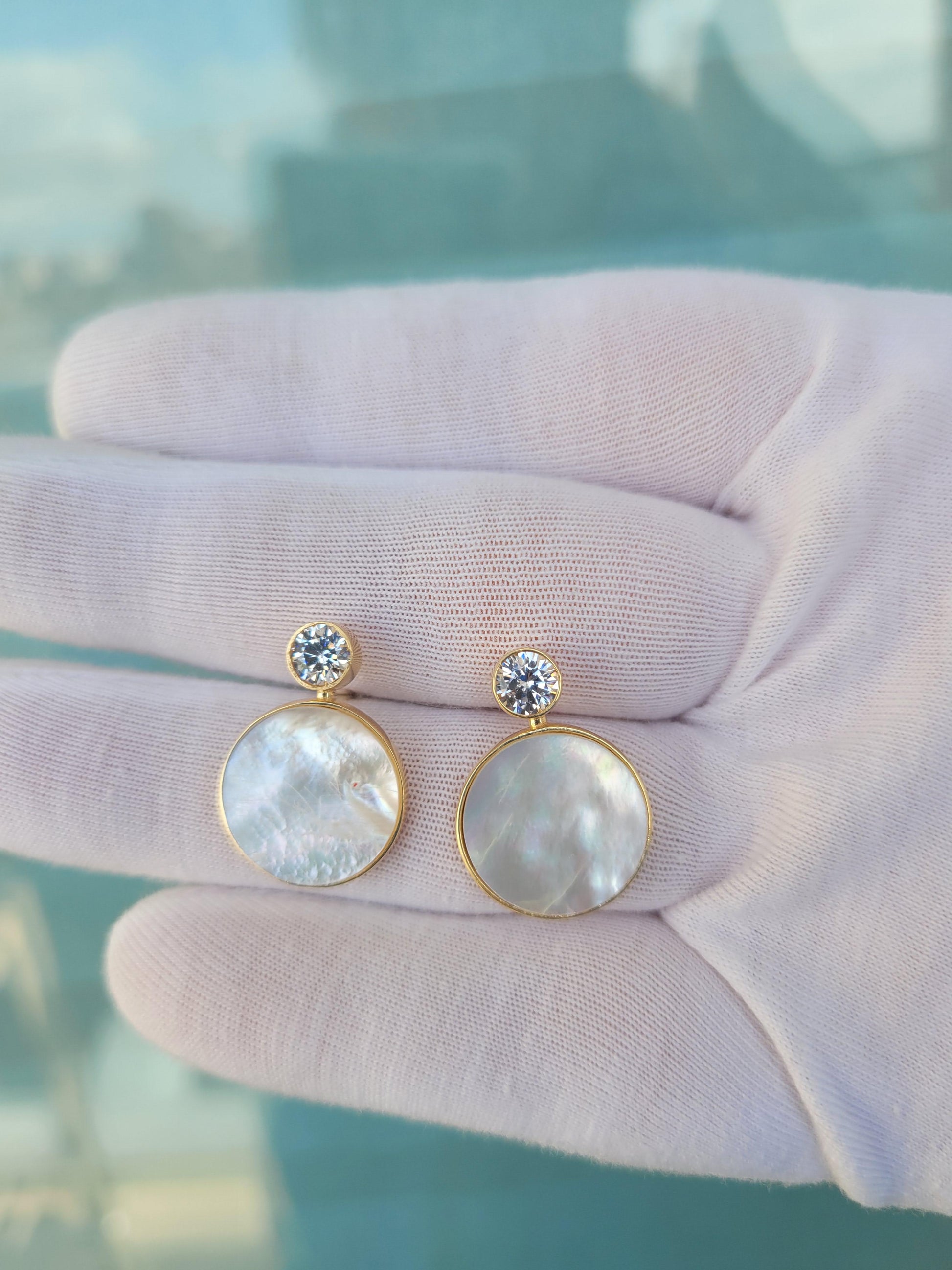 White Mother Of Pearl Shell Stud Earrings with moissanite.