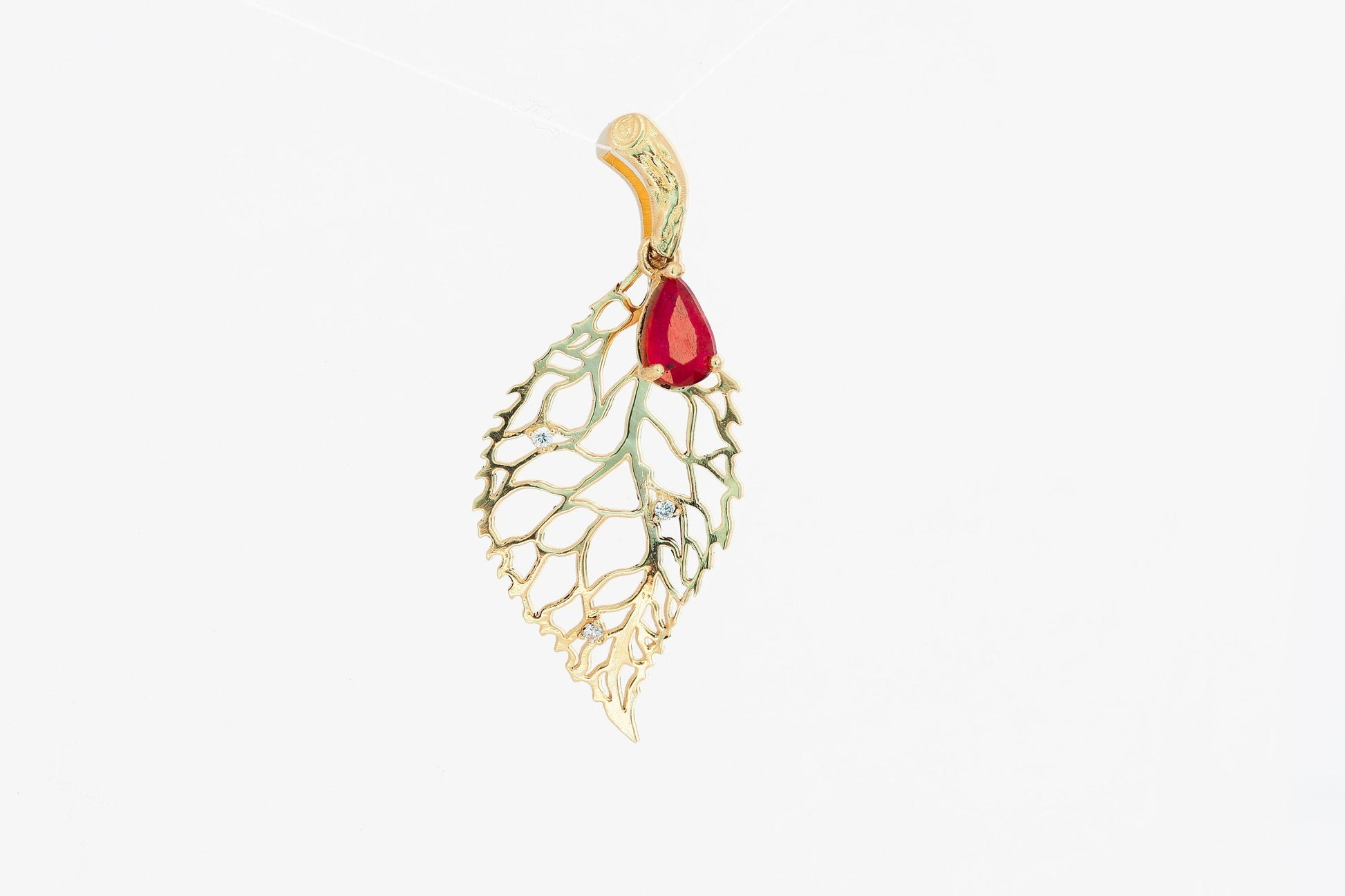 Leaf pendant with ruby and diamonds in 14k gold