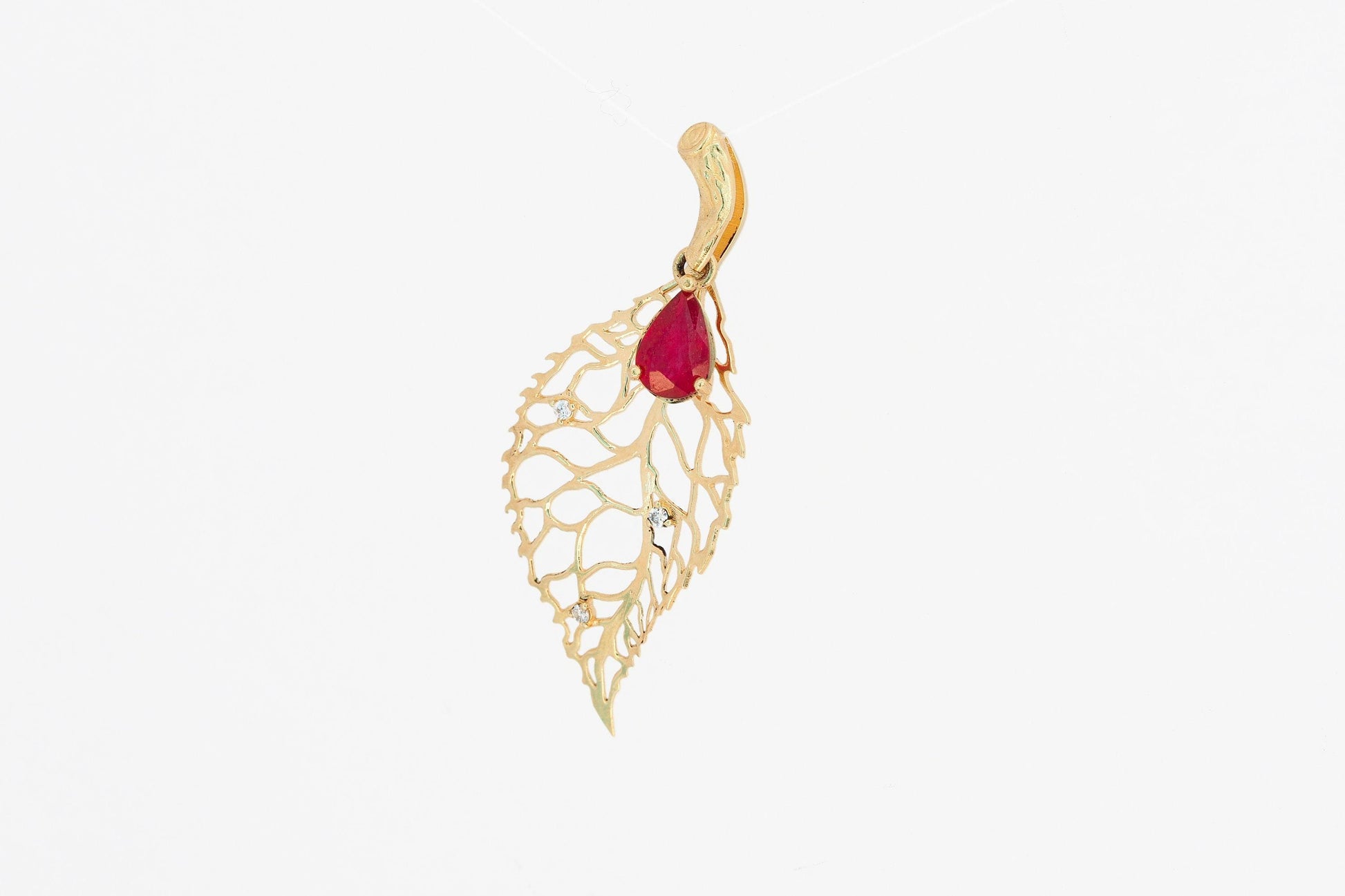 Leaf pendant with ruby and diamonds in 14k gold