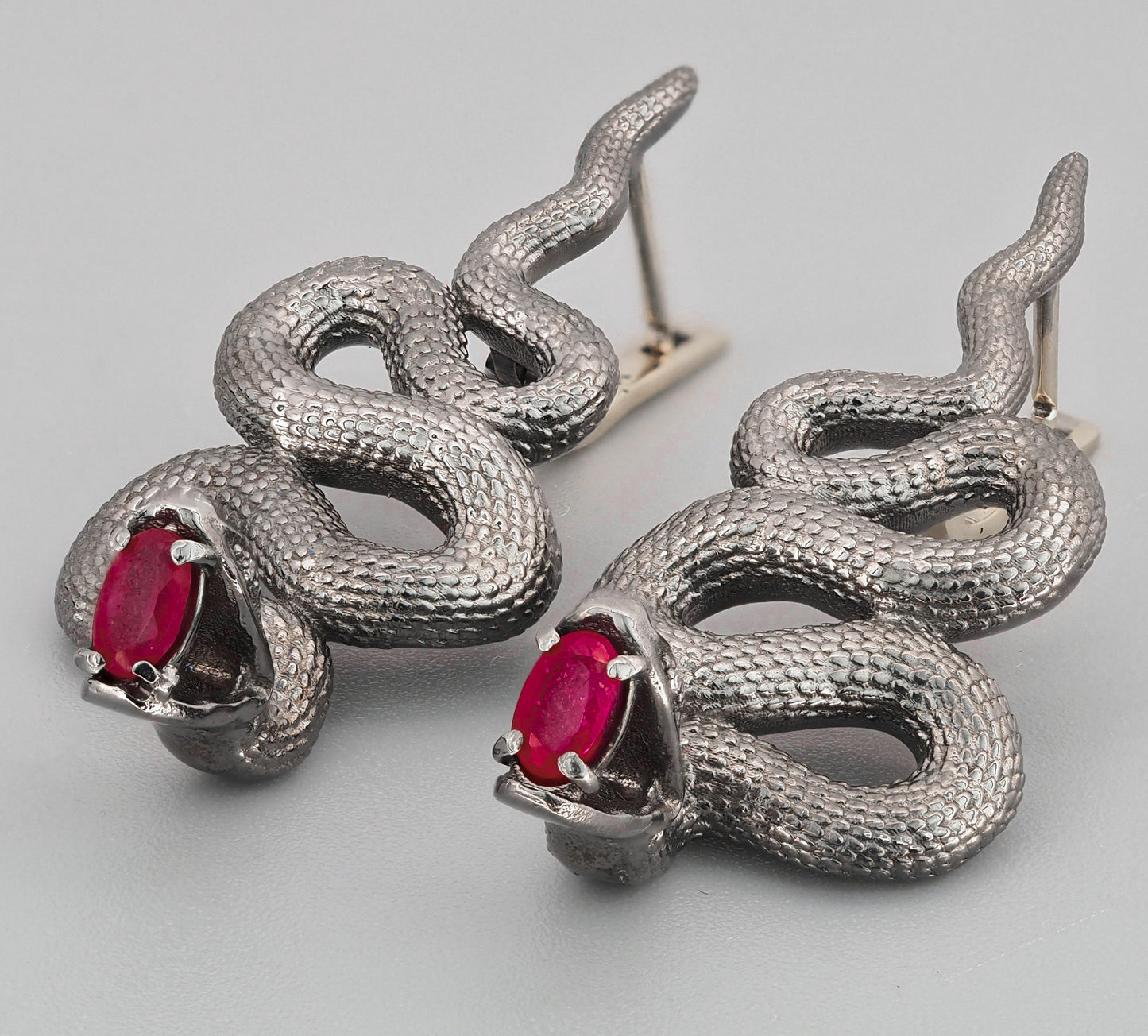 Massive snake earrings with rubies