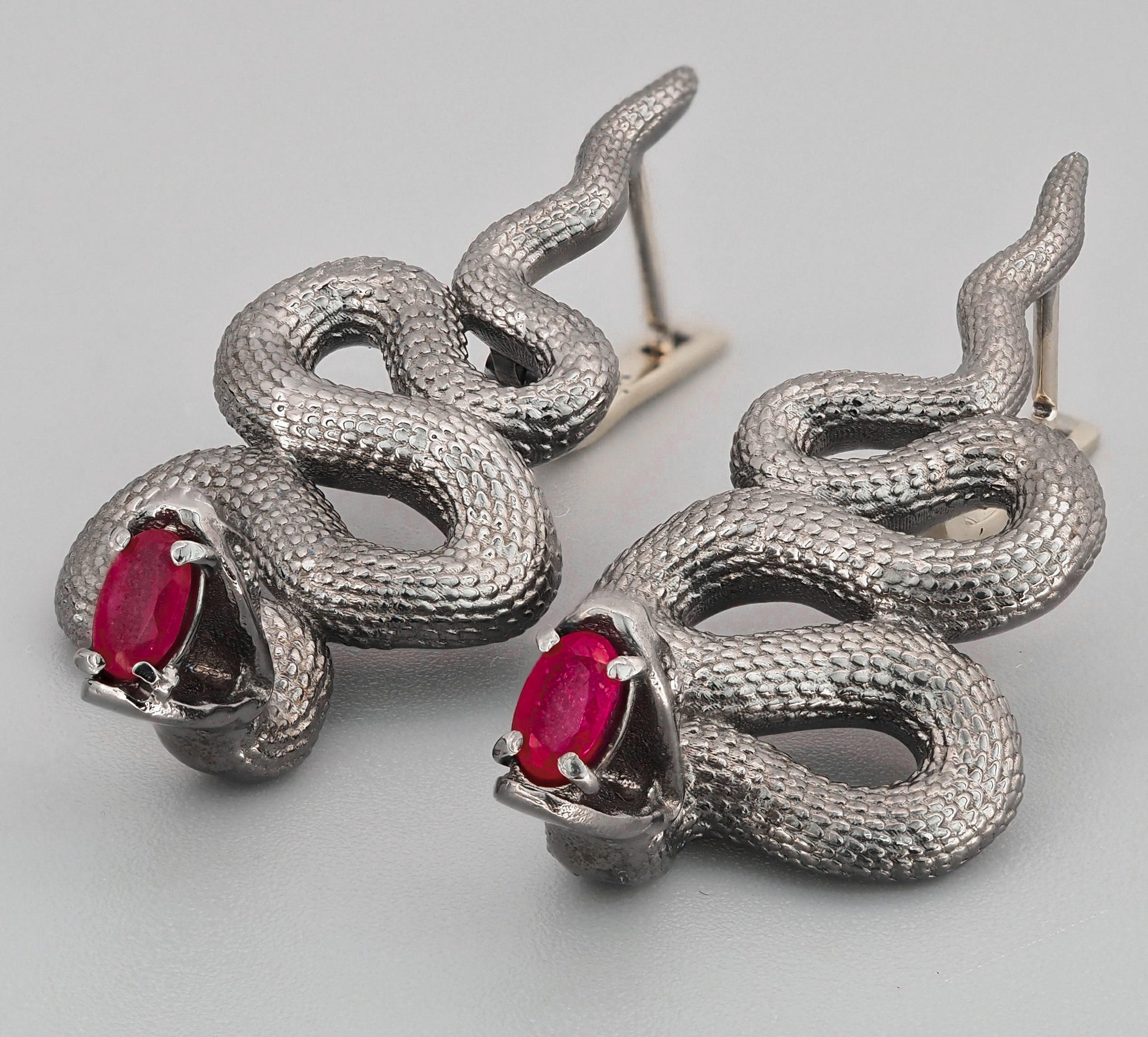 Massive snake earrings with rubies