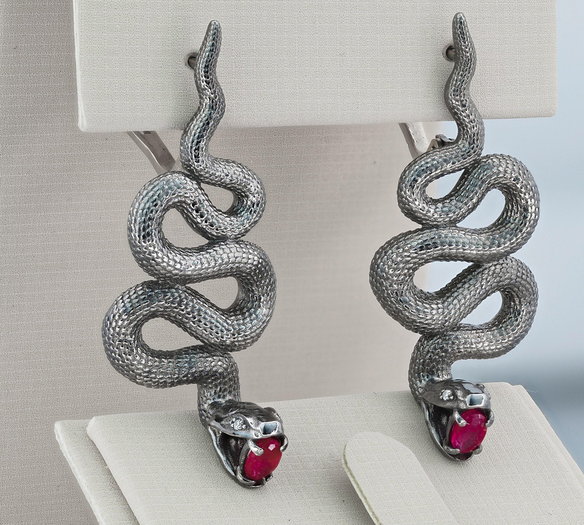 Massive snake earrings with rubies