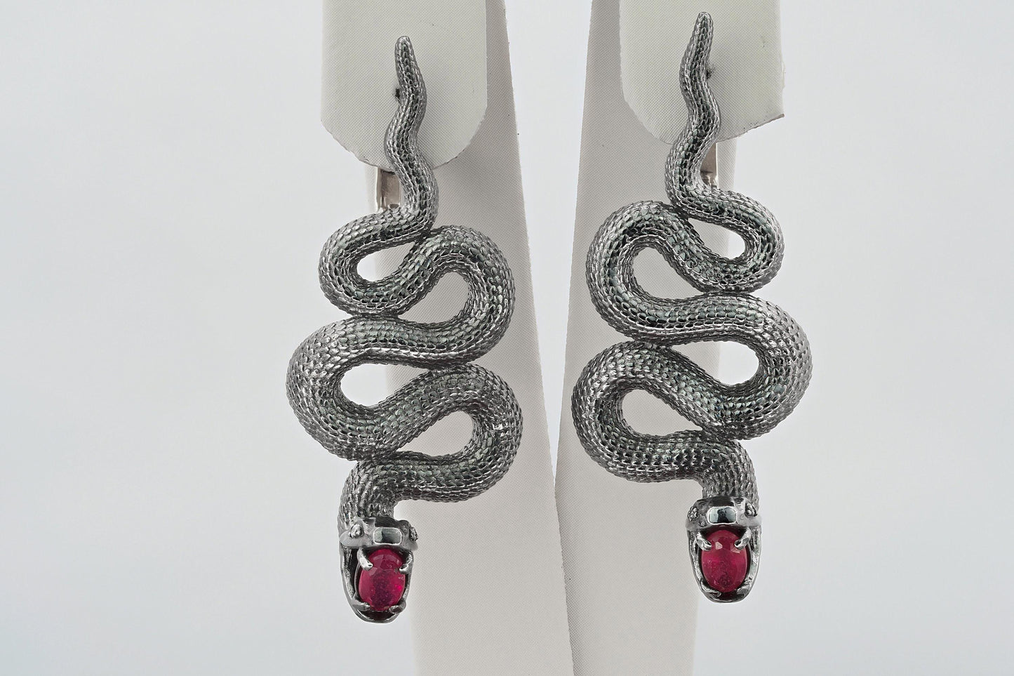 Massive snake earrings with rubies