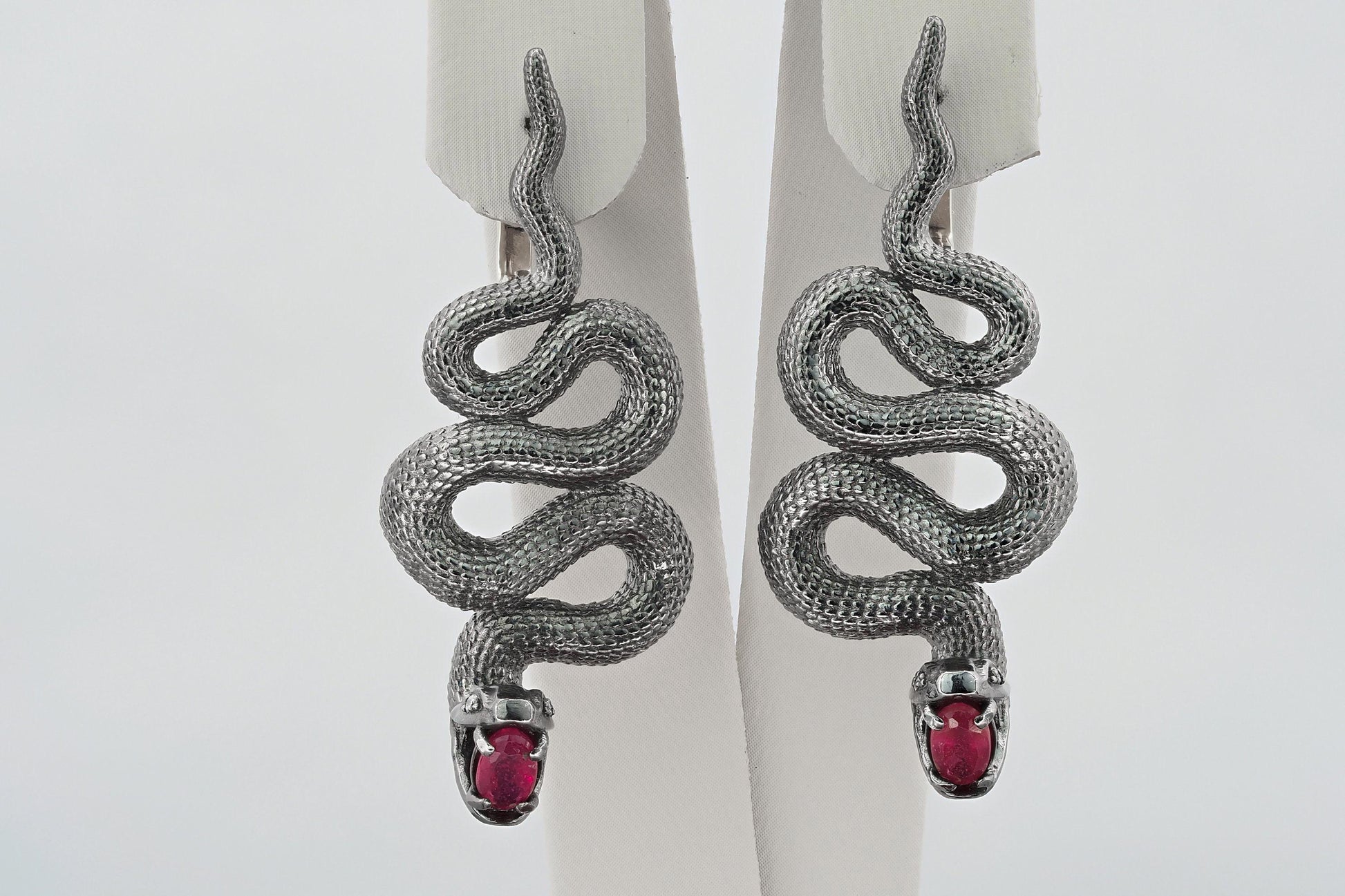 Massive snake earrings with rubies
