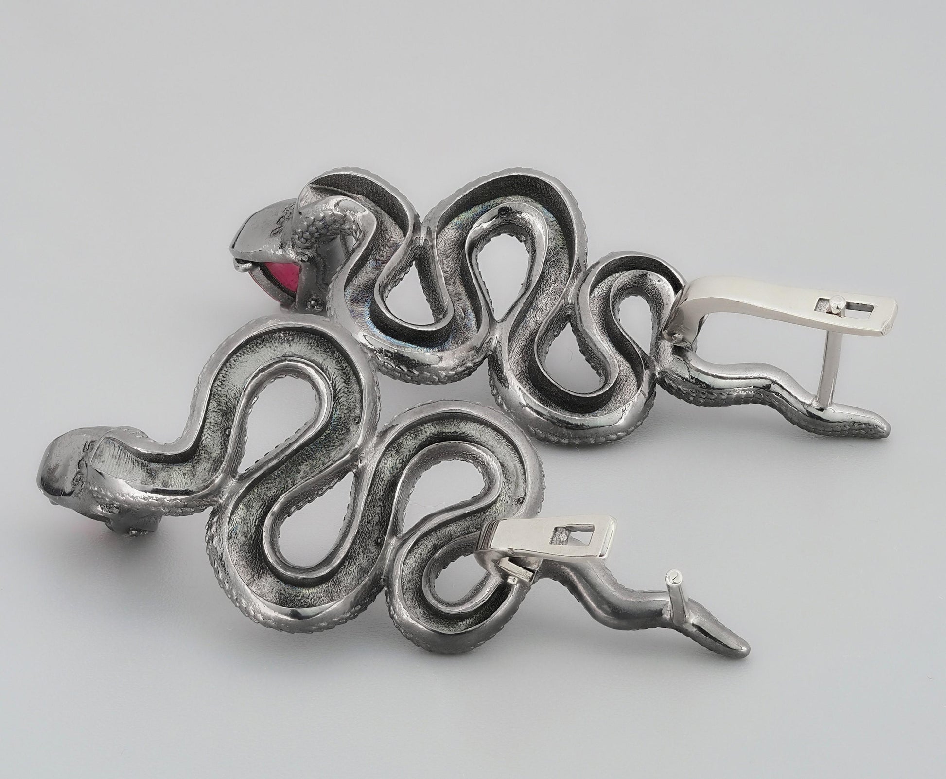 Massive snake earrings with rubies