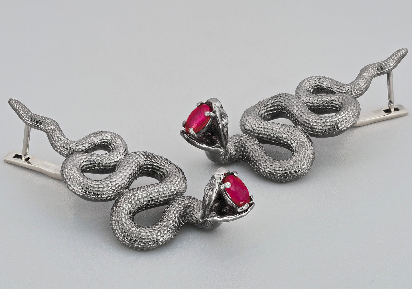 Massive snake earrings with rubies