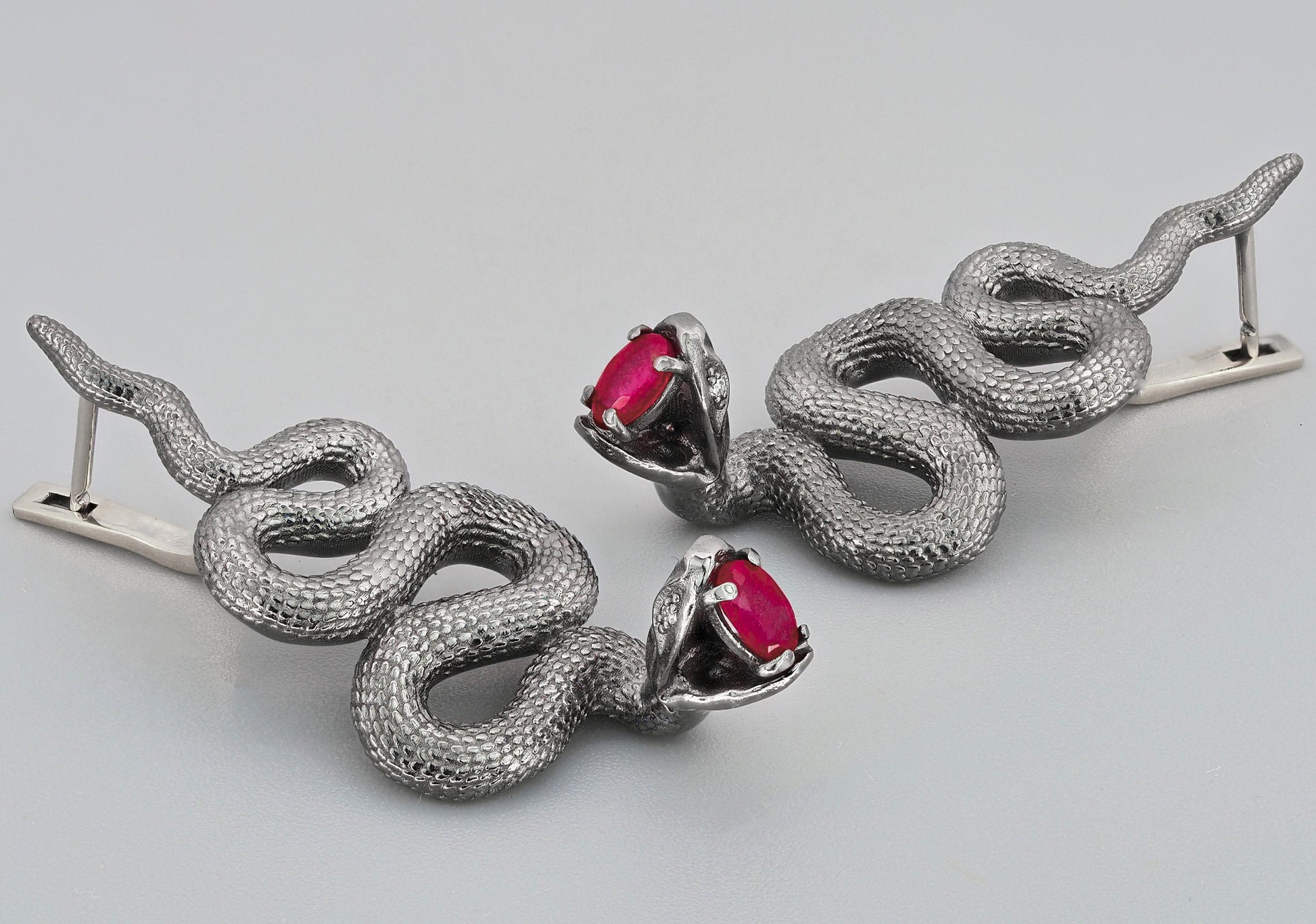 Massive snake earrings with rubies