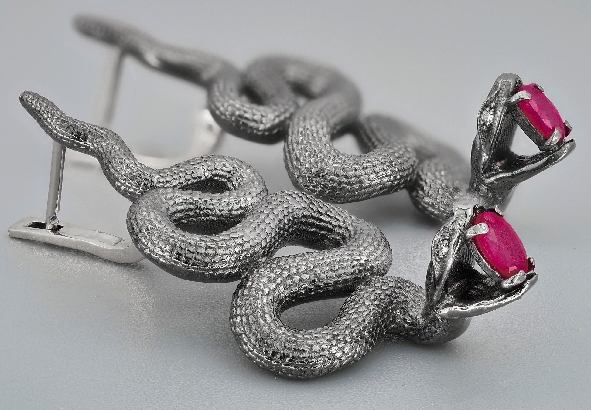 Massive snake earrings with rubies