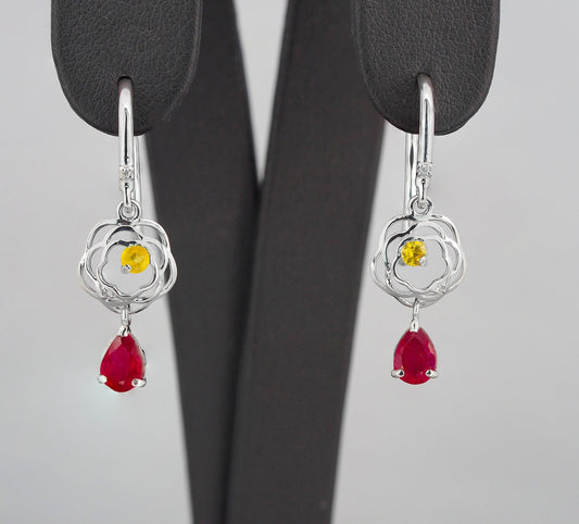 Pear ruby drop earrings in 14k gold