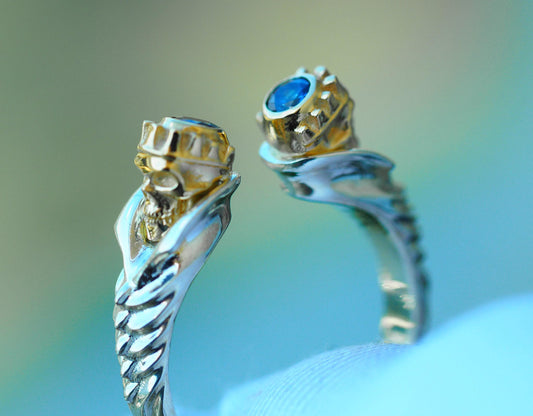 Skull ring with blue sapphires in 14k gold
