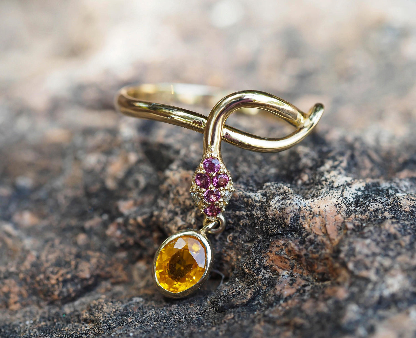 Snake ring with sapphire, diamonds in 14k gold