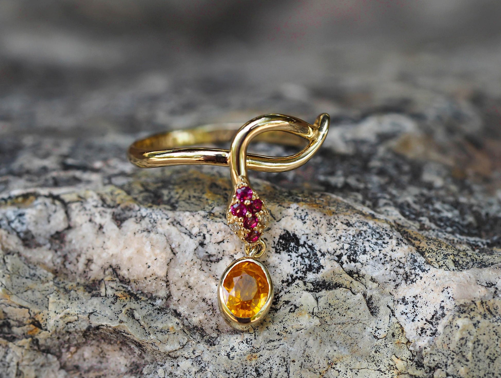 Snake ring with sapphire, diamonds in 14k gold