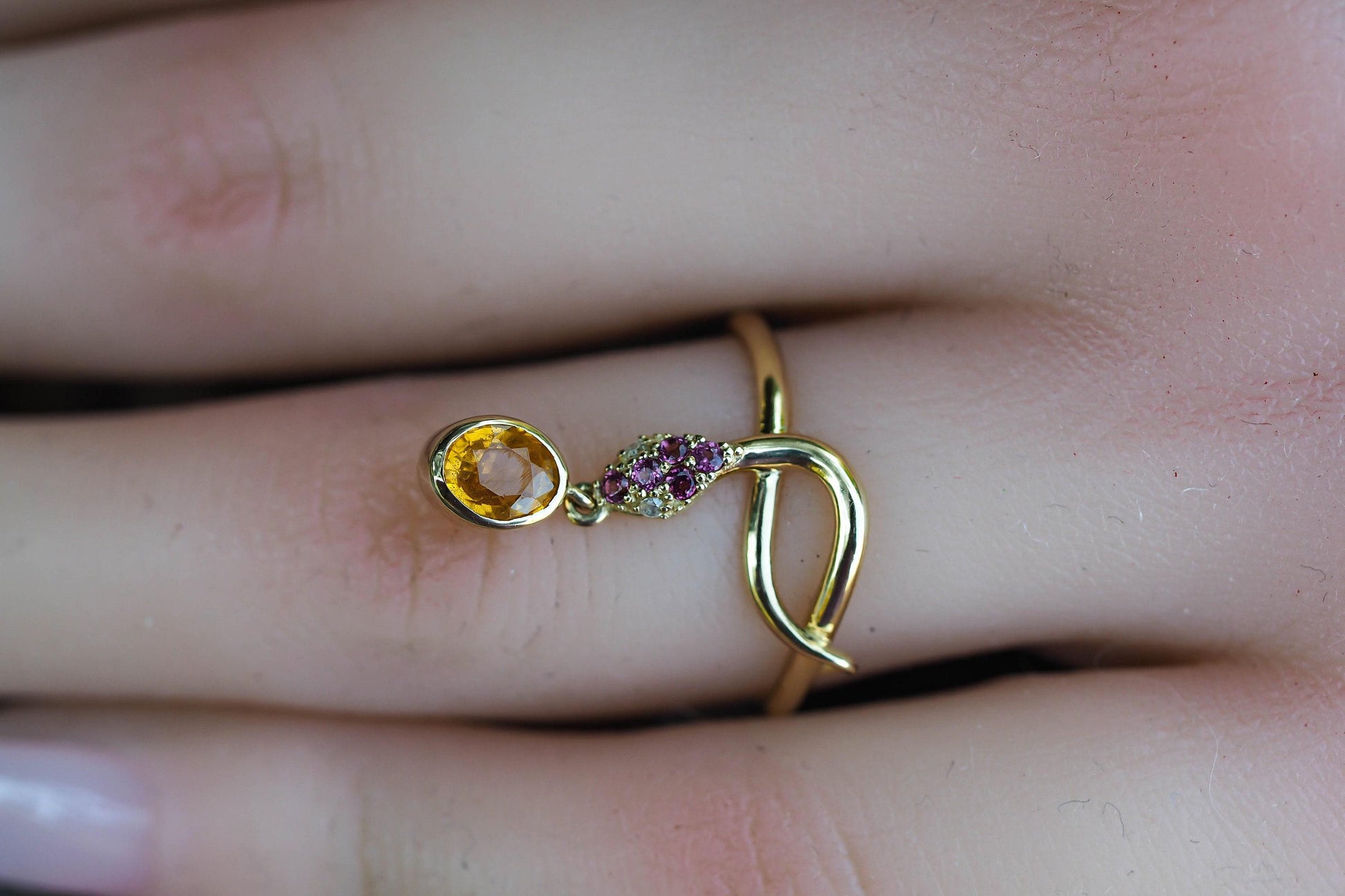 Snake ring with sapphire, diamonds in 14k gold