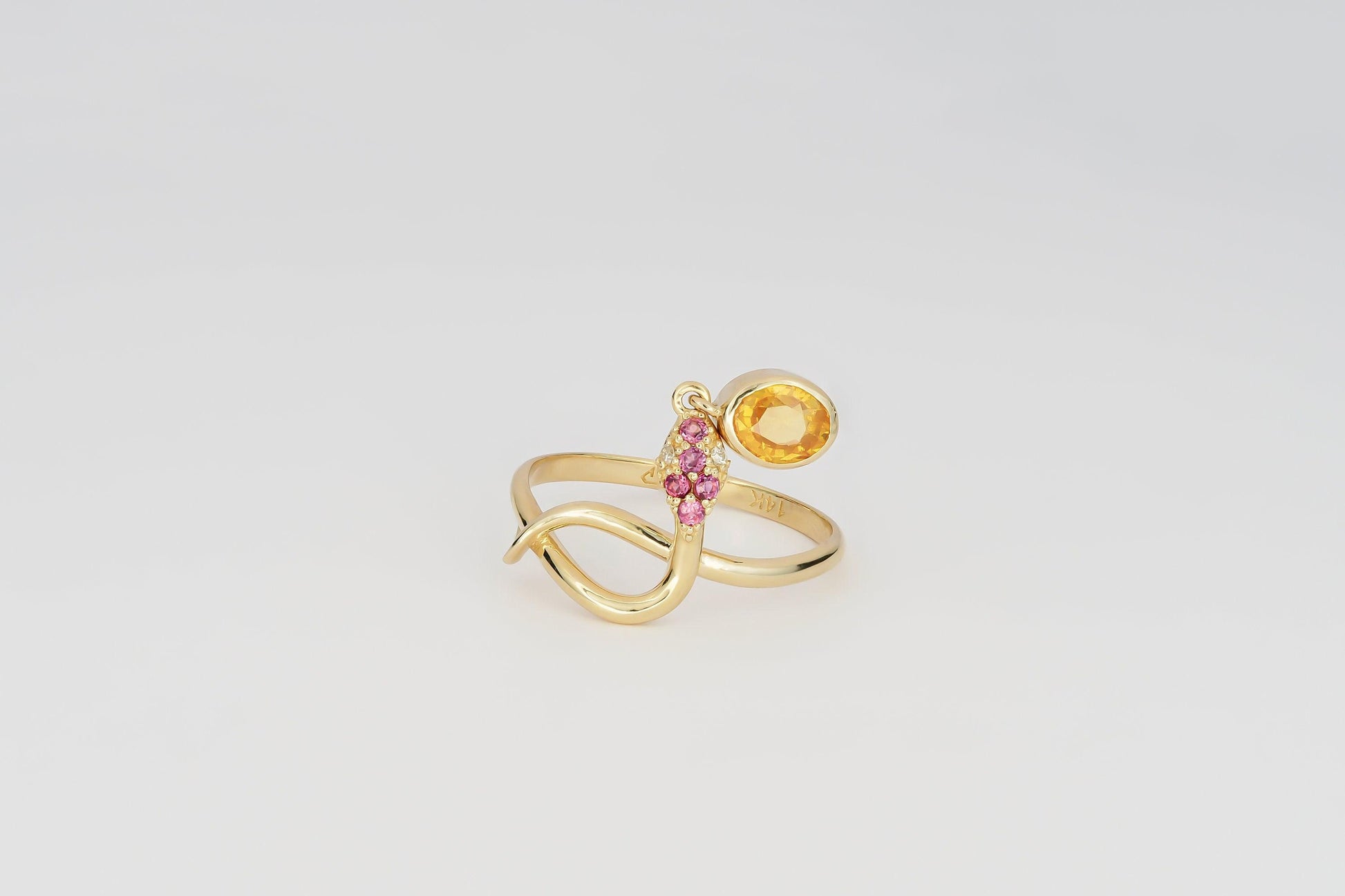 Snake ring with sapphire, diamonds in 14k gold