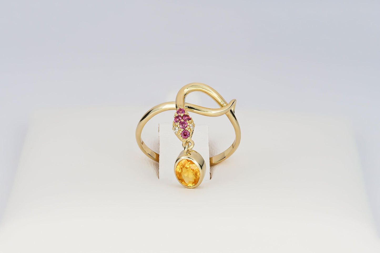 Snake ring with sapphire, diamonds in 14k gold