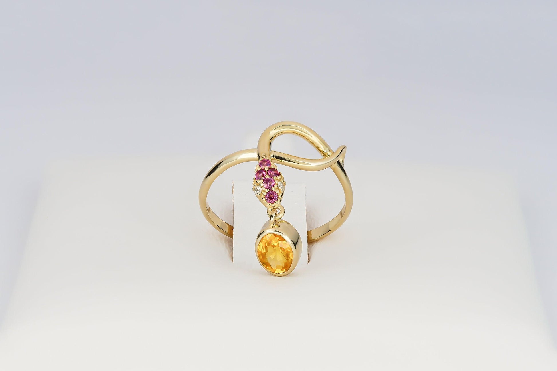 Snake ring with sapphire, diamonds in 14k gold