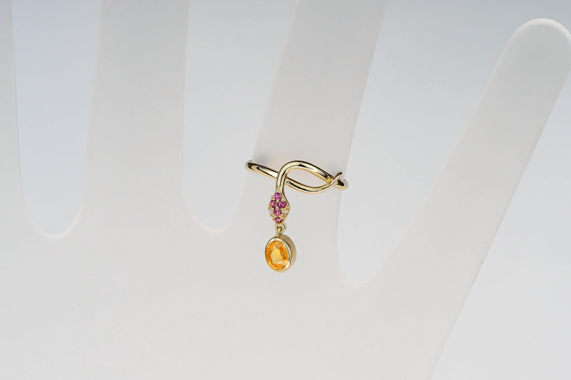 Snake ring with sapphire, diamonds in 14k gold