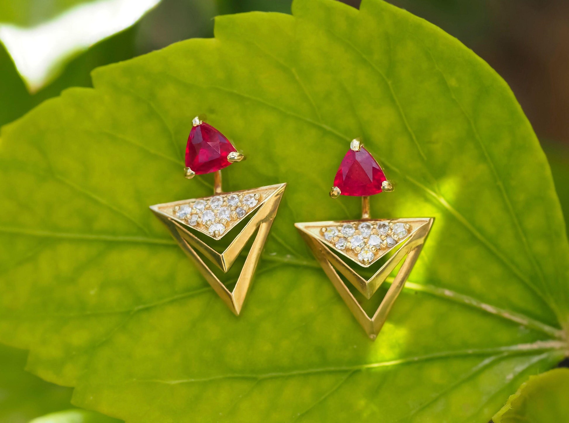 Trillion cut ruby stud earrings in 14k solid gold