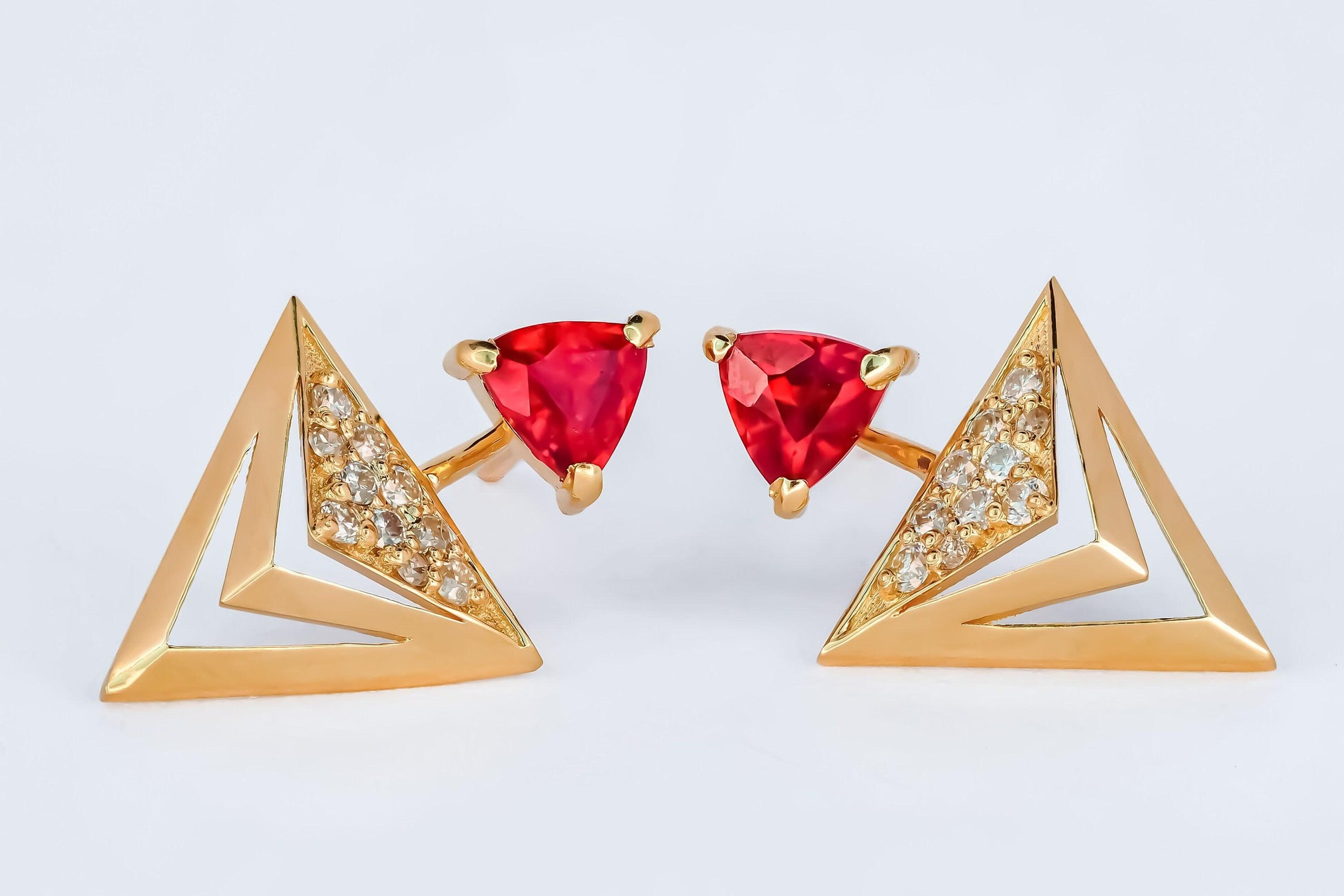 Trillion cut ruby stud earrings in 14k solid gold