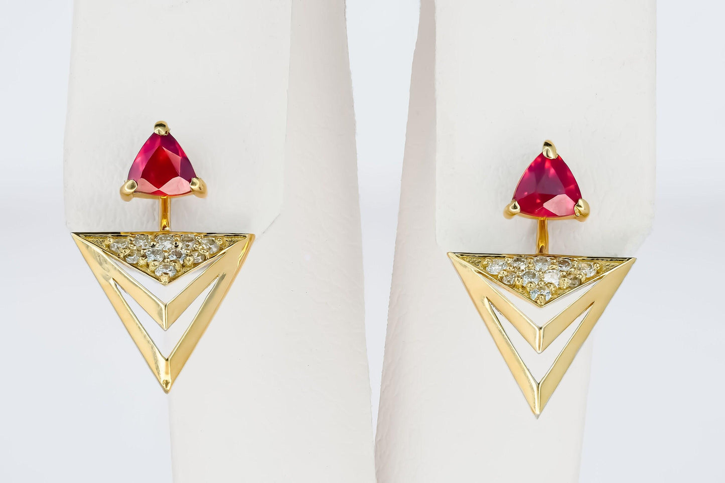 Trillion cut ruby stud earrings in 14k solid gold