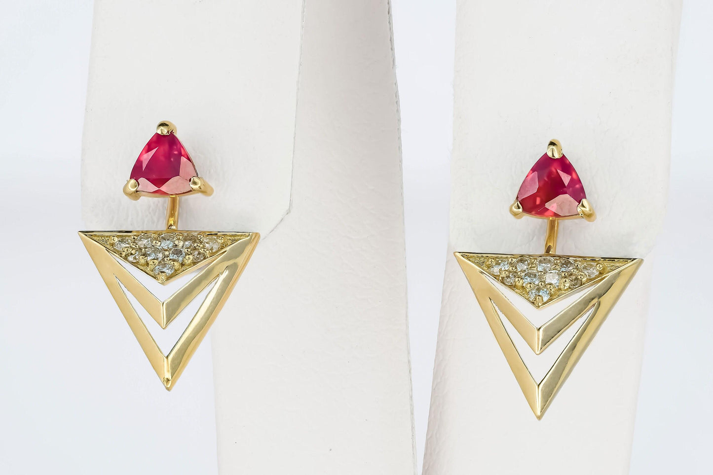 Trillion cut ruby stud earrings in 14k solid gold