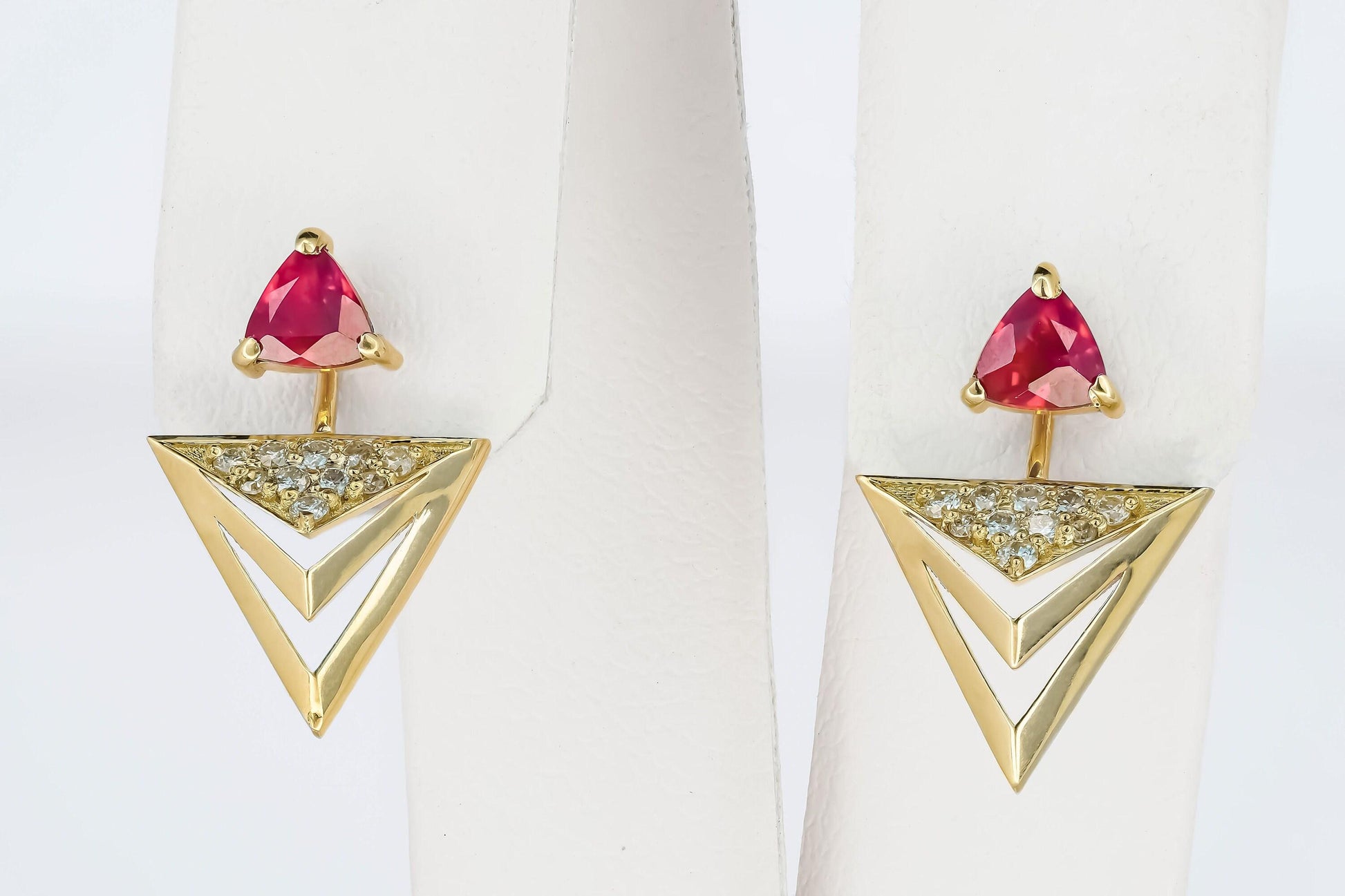 Trillion cut ruby stud earrings in 14k solid gold