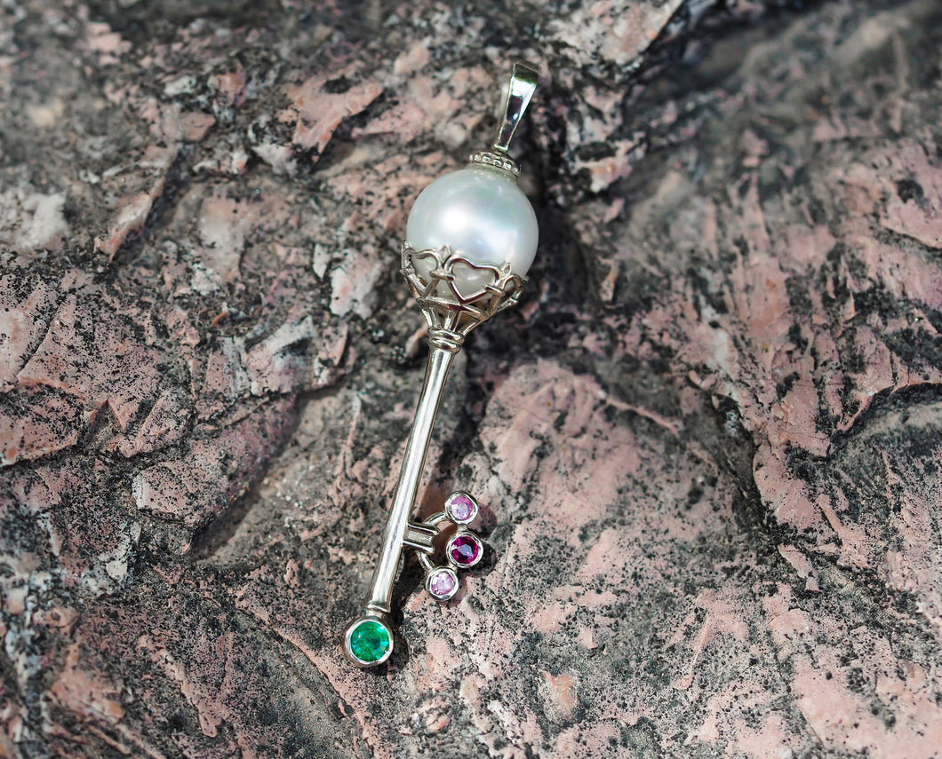 Solid 14 K Gold Key pendant with pearl, emerald and sapphires. Crown Key pendant with colored gemstones.