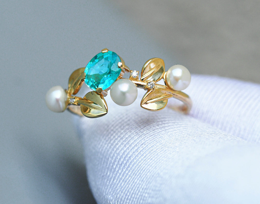 14k gold floral ring with oval neon paraiba apatite, diamonds and pearls.  Plant flower engagement ring. Neon paraiba blue gemstone ring.