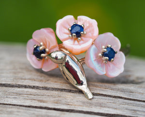 14k gold ring with round sapphires. Shell flower gold ring. Bird on branch ring. Bird on twig ring. Blue sapphire ring. Floral gold ring.