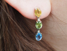 Load image into Gallery viewer, 14 kt solid gold earrings studs with 3 color of natural sapphires and diamonds. Blue, yellow green oval sapphire earrings.Statement earrings