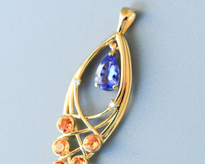 Solid 14 Kt Gold Pendant with natural Tanzanite, Sapphires and Diamonds. Yellow sapphire pendant. Teardrop Tanzanite. December birthstone.