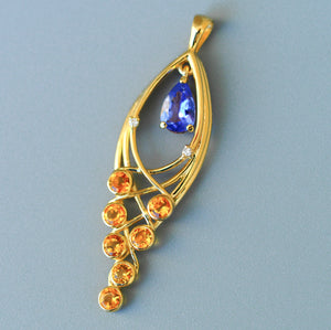 Solid 14 Kt Gold Pendant with natural Tanzanite, Sapphires and Diamonds. Yellow sapphire pendant. Teardrop Tanzanite. December birthstone.