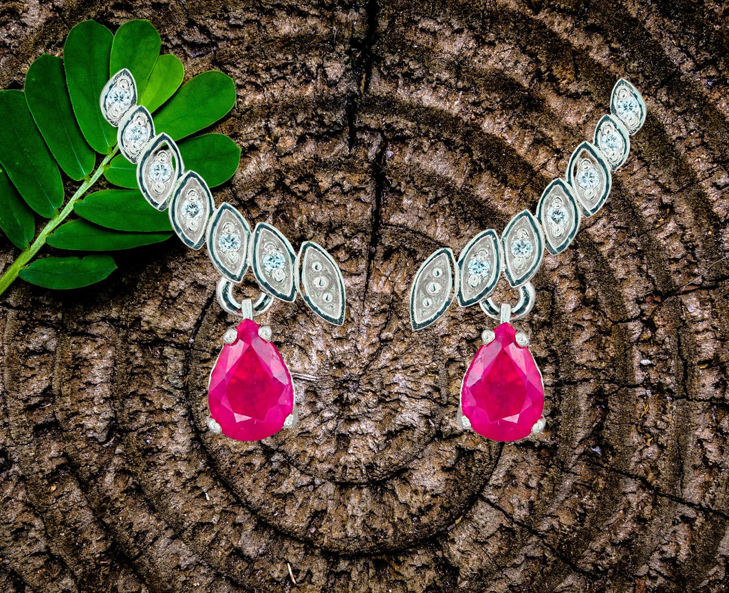 Genuine 1.5 ct rubies and diamonds earrings studs. 14k solid gold studs. Pear cut ruby earrings.